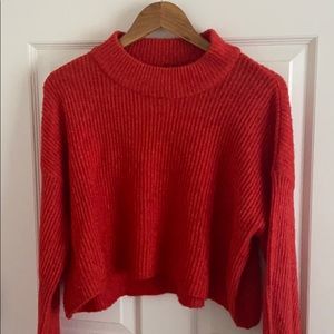High neck red sweater with bell sleeves